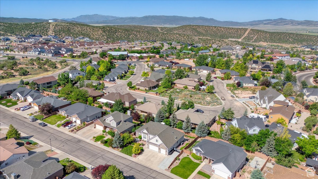 View of property location with nearby suburban area and mountains