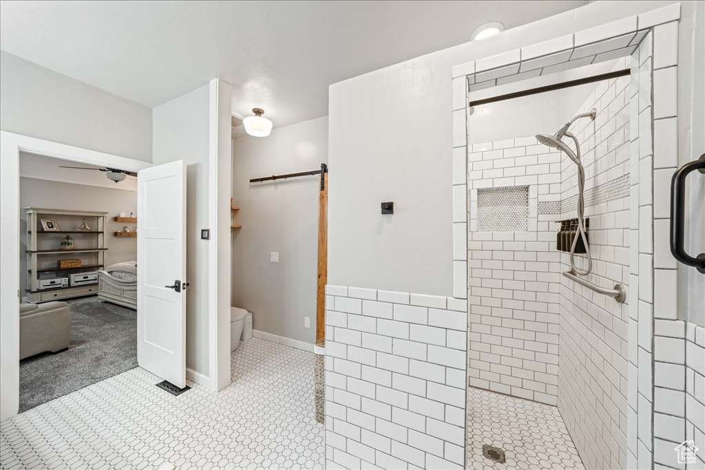 Bathroom featuring a walk in shower and tile patterned floors