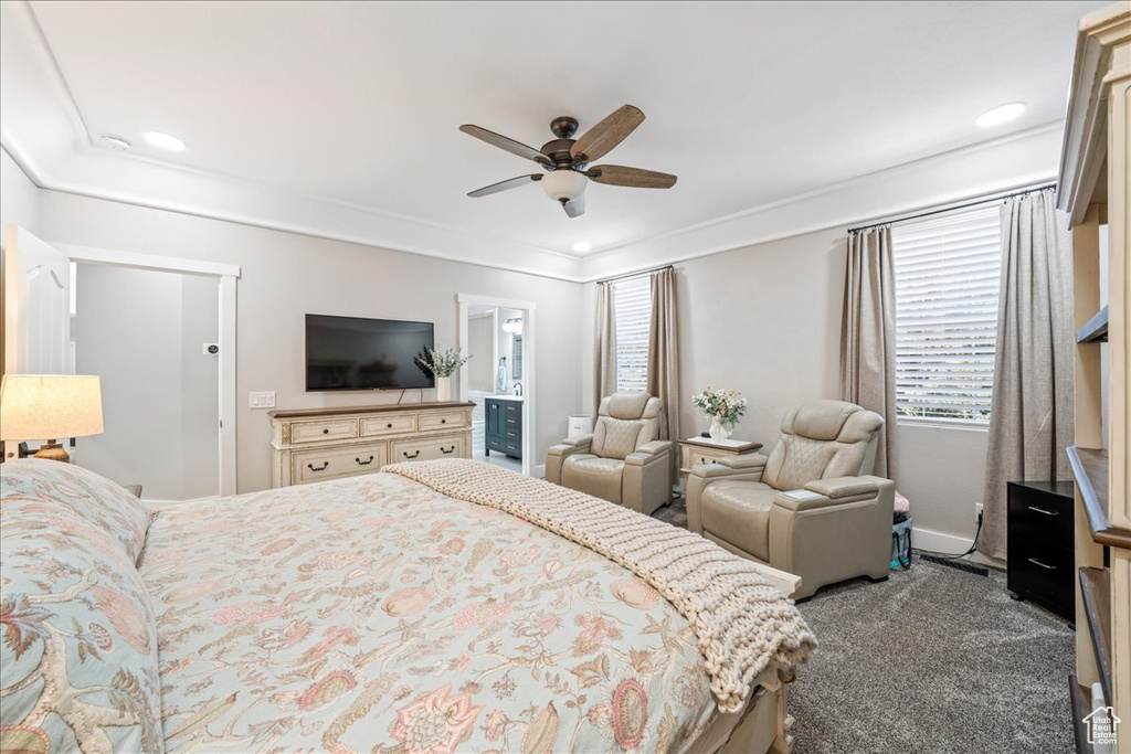 Bedroom with dark colored carpet, recessed lighting, crown molding, and a ceiling fan