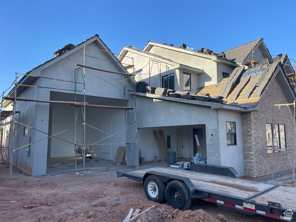 Back of property with stucco siding