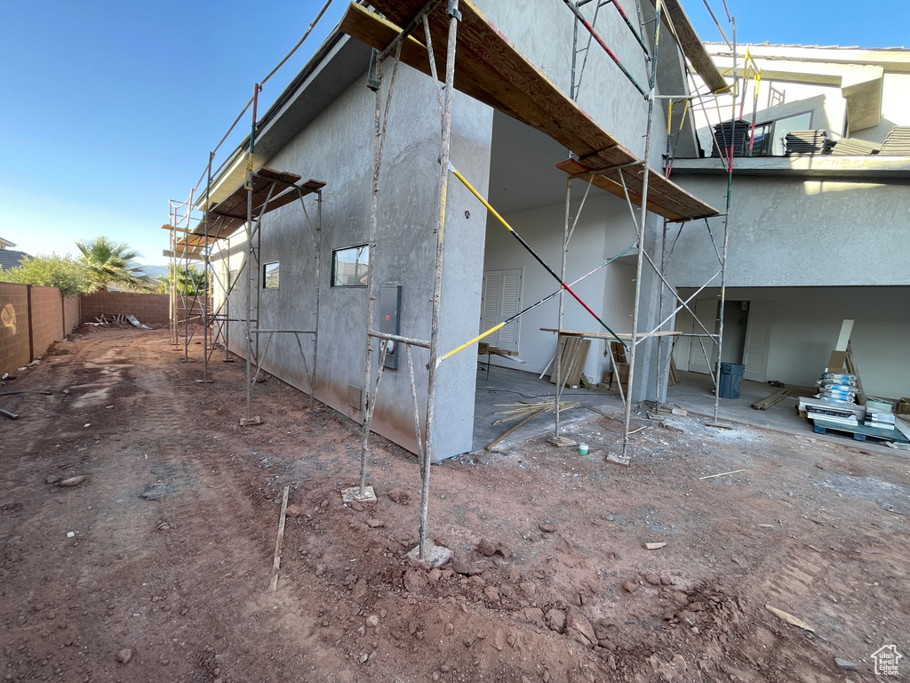 View of side of home featuring stucco siding