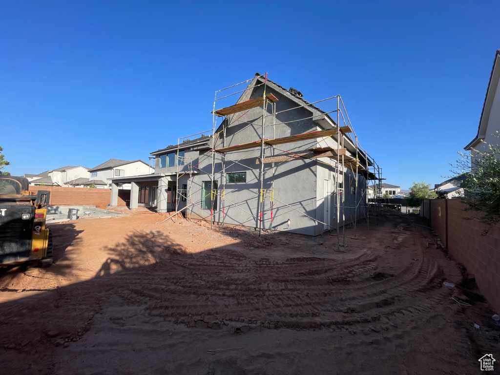 Back of property with a fenced backyard