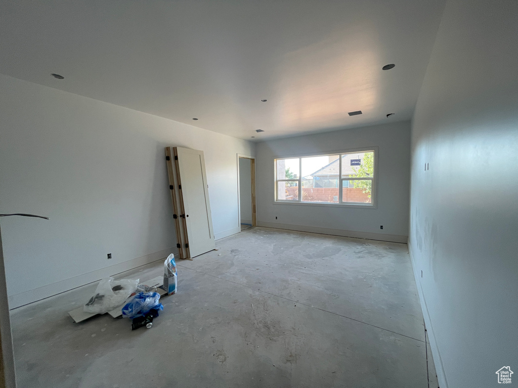 Unfurnished room featuring concrete floors