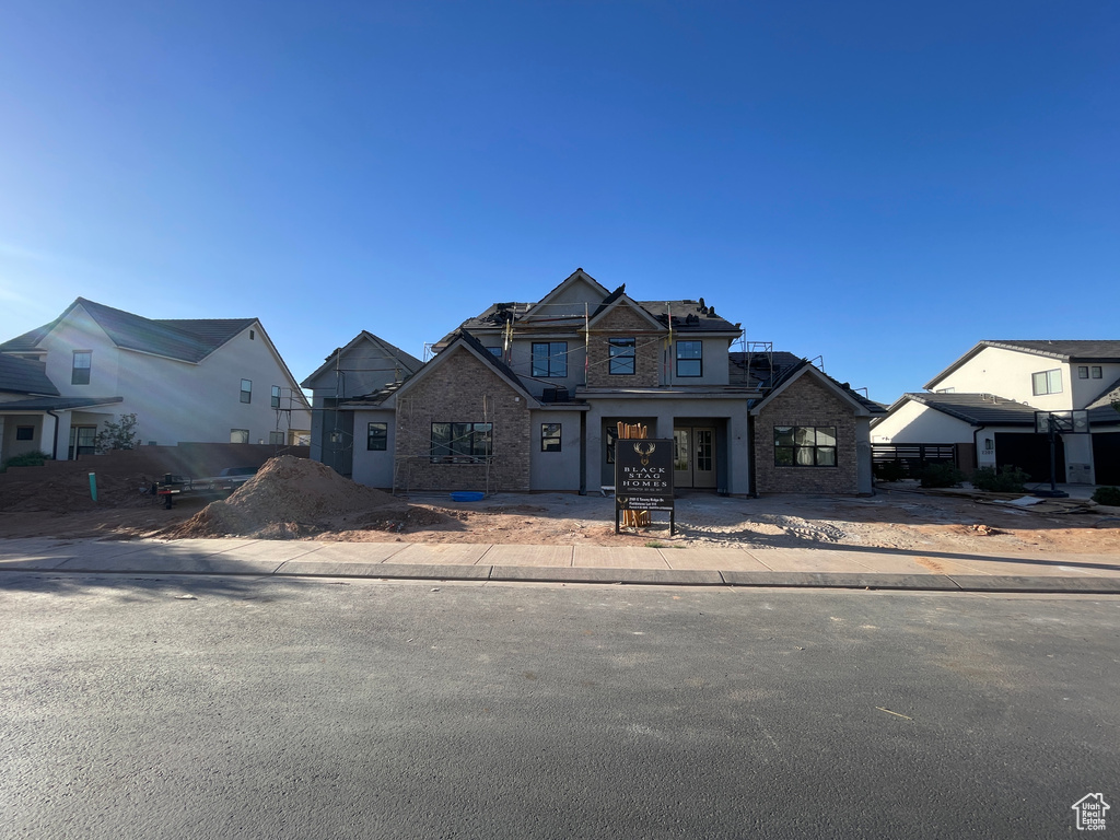 View of front of house with brick siding and a residential view