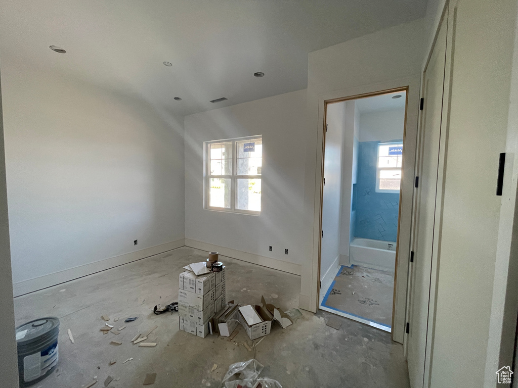 Unfurnished bedroom with multiple windows