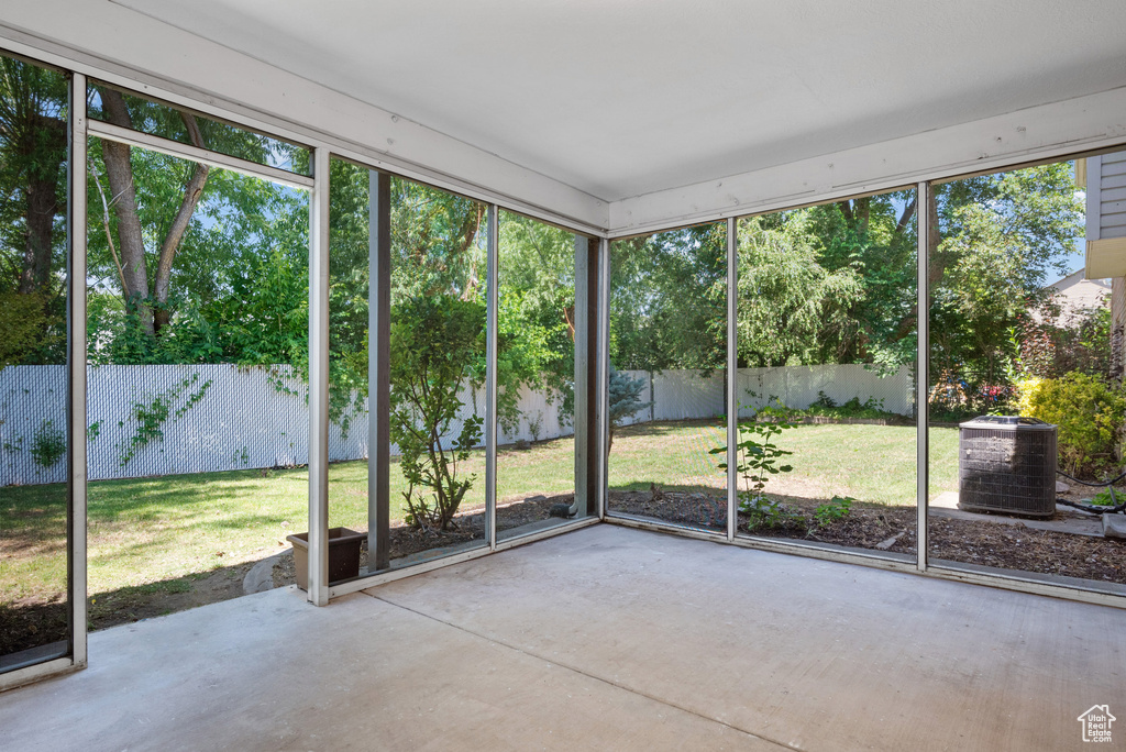 Unfurnished sunroom featuring plenty of natural light