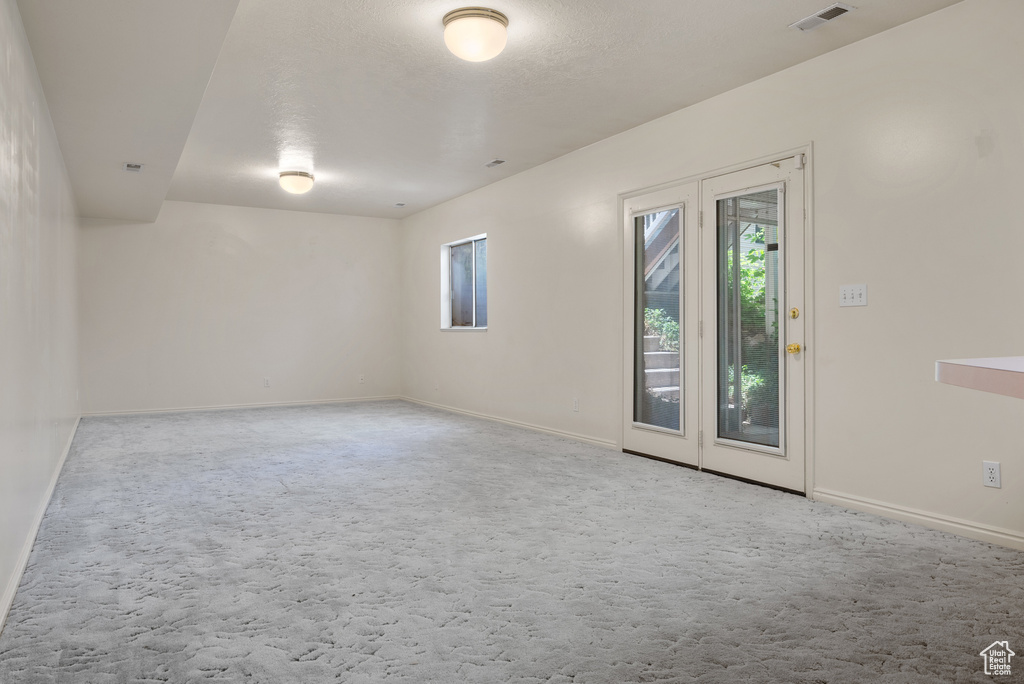 Spare room featuring carpet floors