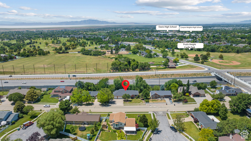 Aerial view of residential area featuring a mountain backdrop