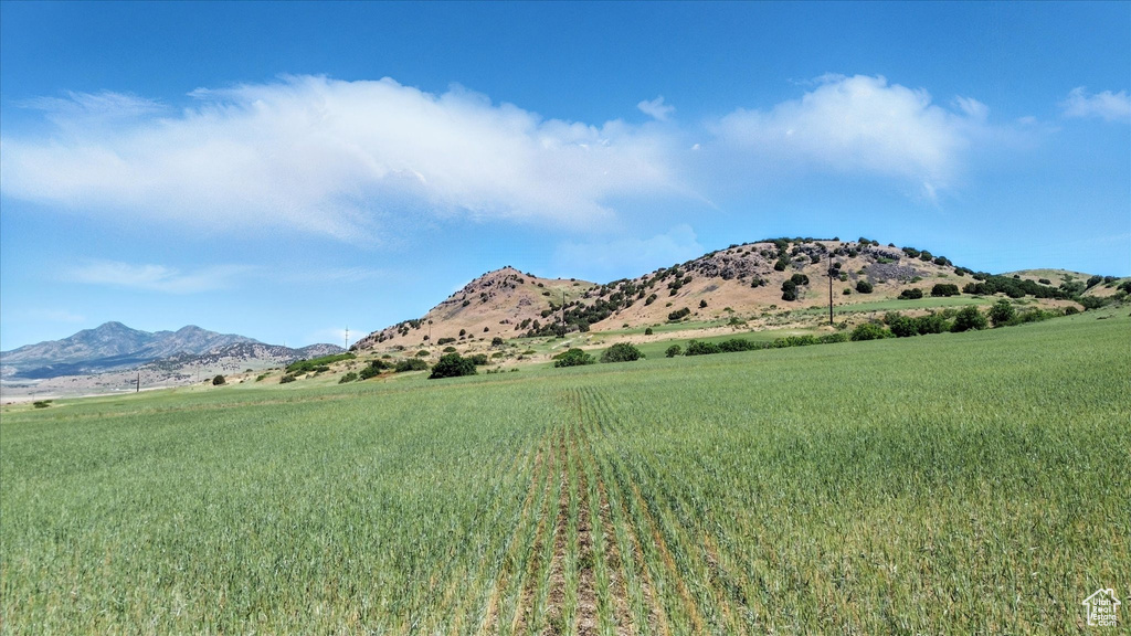 View of mountain backdrop featuring rural landscape