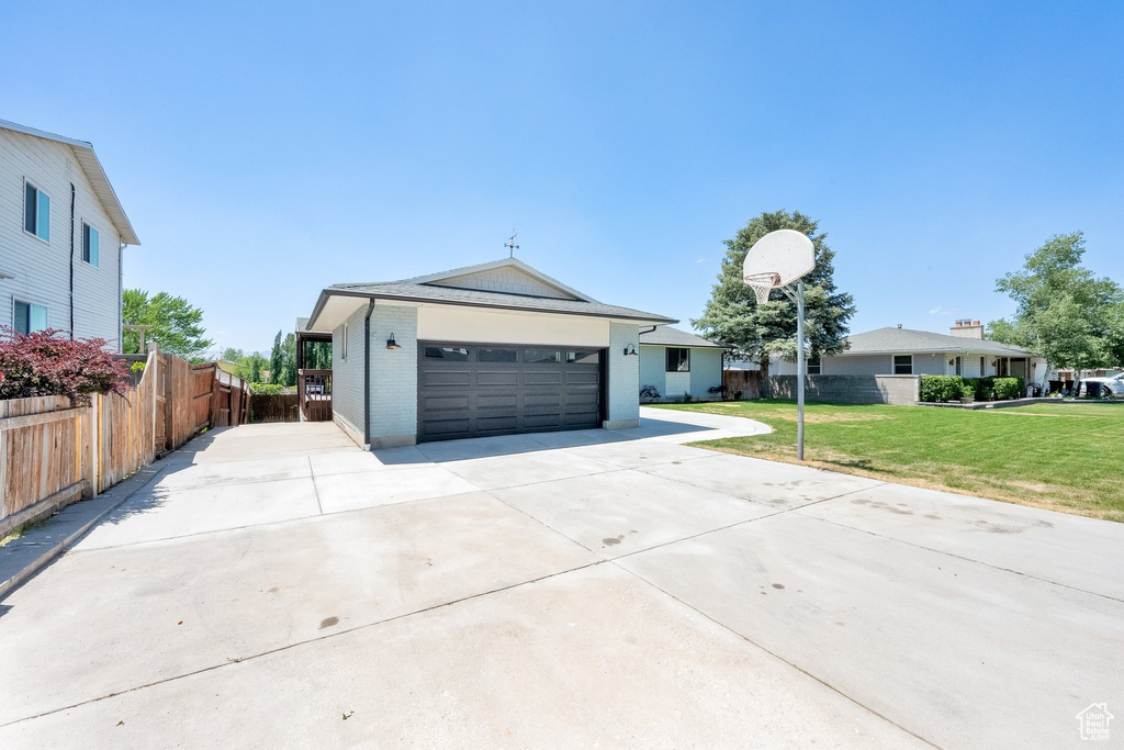 Ranch-style home with driveway and a garage