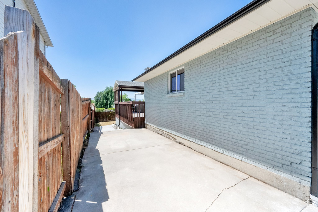 Fenced backyard with a patio