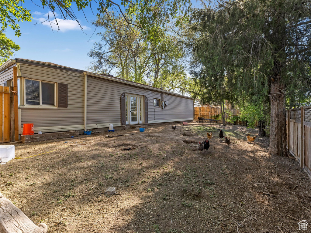 Back of property featuring a fenced backyard