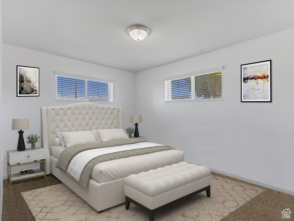 Carpeted bedroom featuring baseboards