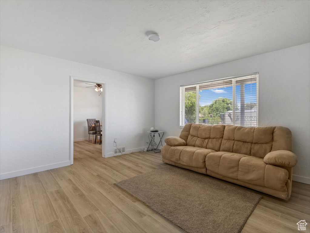 Living area with light wood-type flooring
