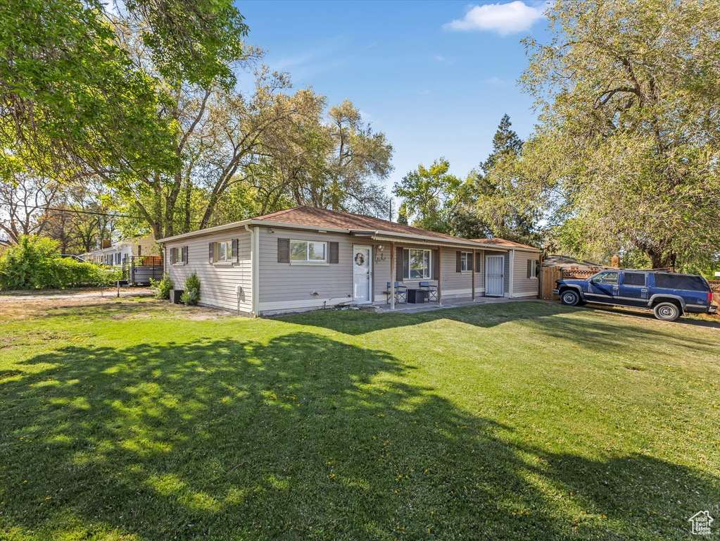 View of front of house with a front yard
