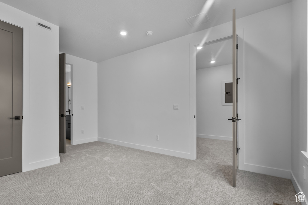 Unfurnished bedroom featuring carpet floors and recessed lighting