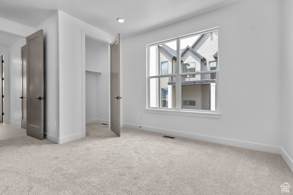 Unfurnished bedroom featuring carpet floors