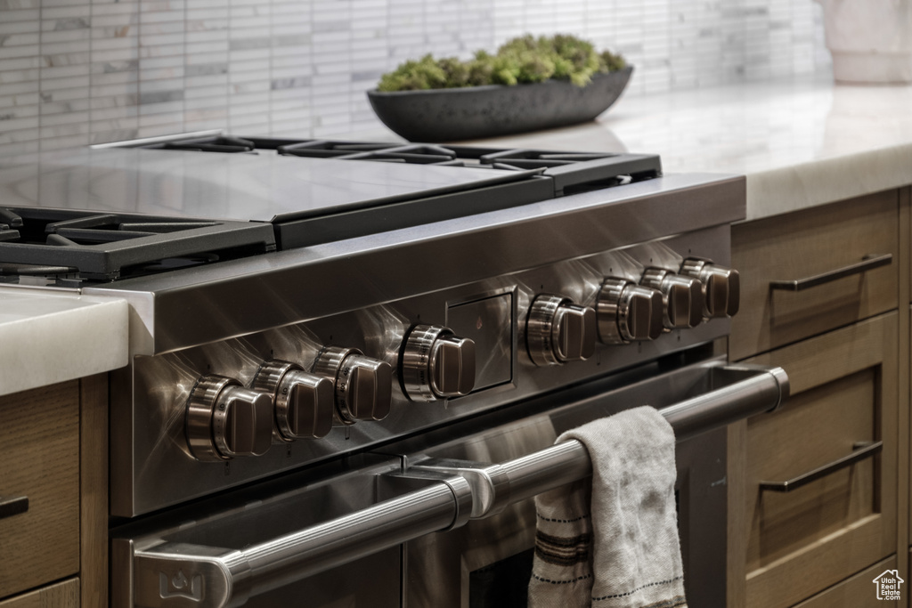 Kitchen view of range with two ovens and decorative backsplash