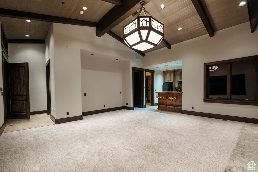 Unfurnished living room with light carpet, recessed lighting, and wooden ceiling