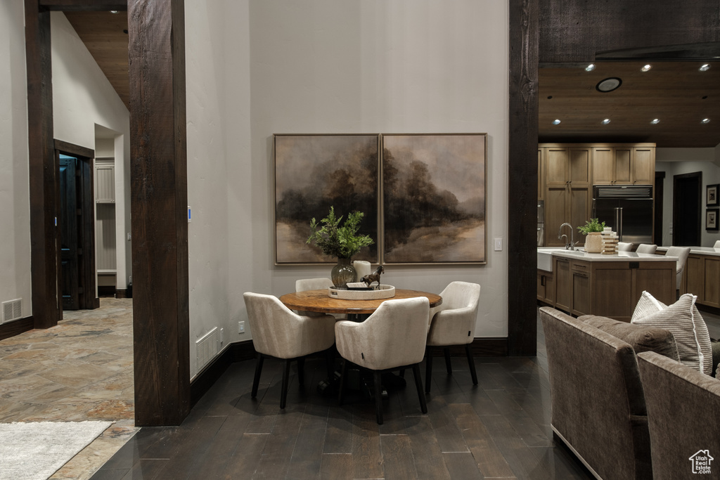 Dining room with recessed lighting and wood finished floors
