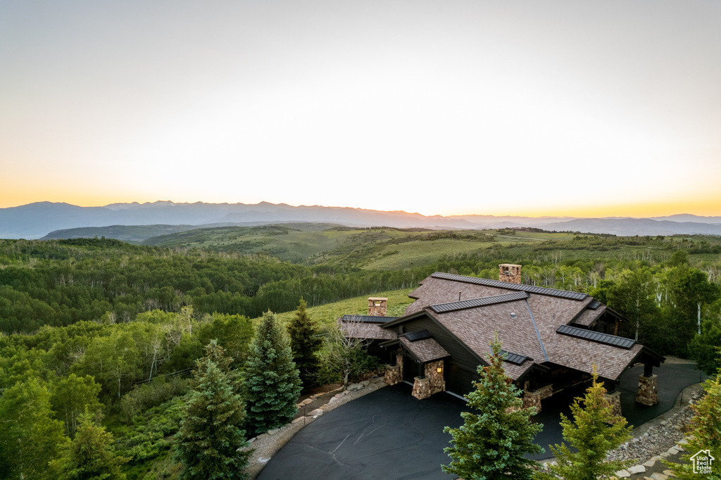 View of mountain backdrop with a heavily wooded area