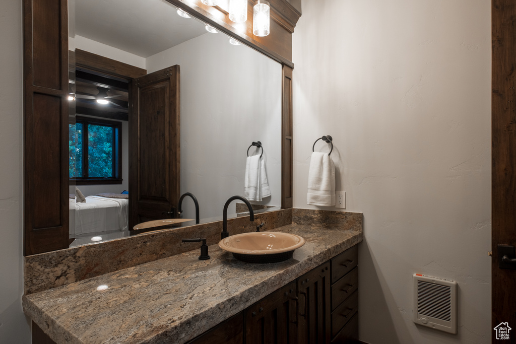 Ensuite bathroom featuring vanity and heating unit