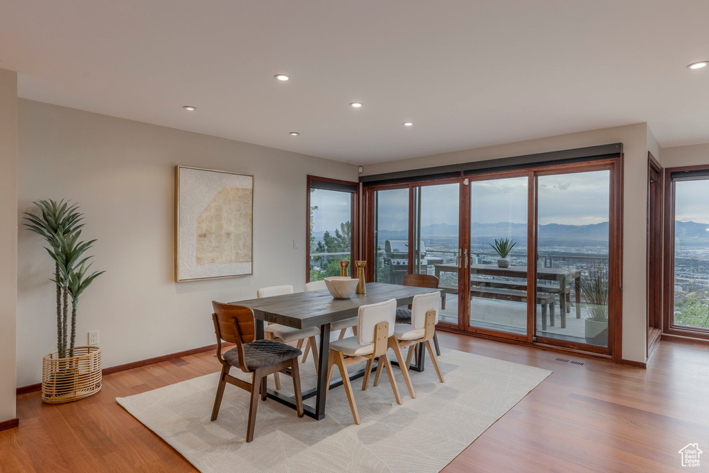 Dining space featuring recessed lighting and light wood finished floors