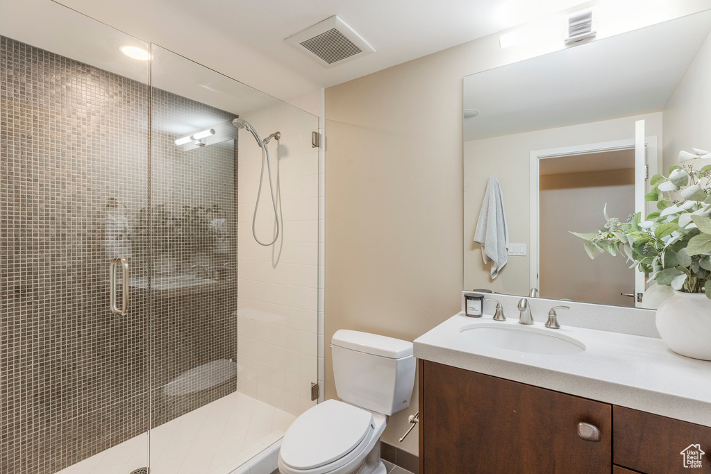 Full bath featuring vanity and a stall shower