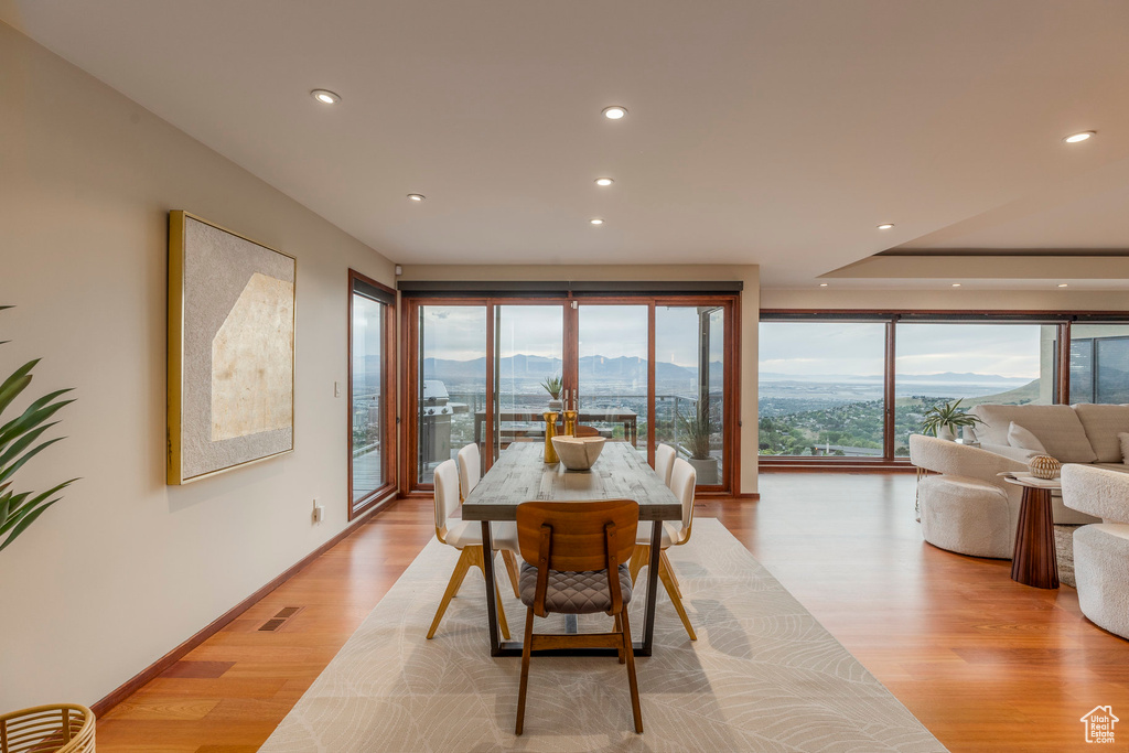 Dining space featuring recessed lighting, a mountain view, and light wood finished floors
