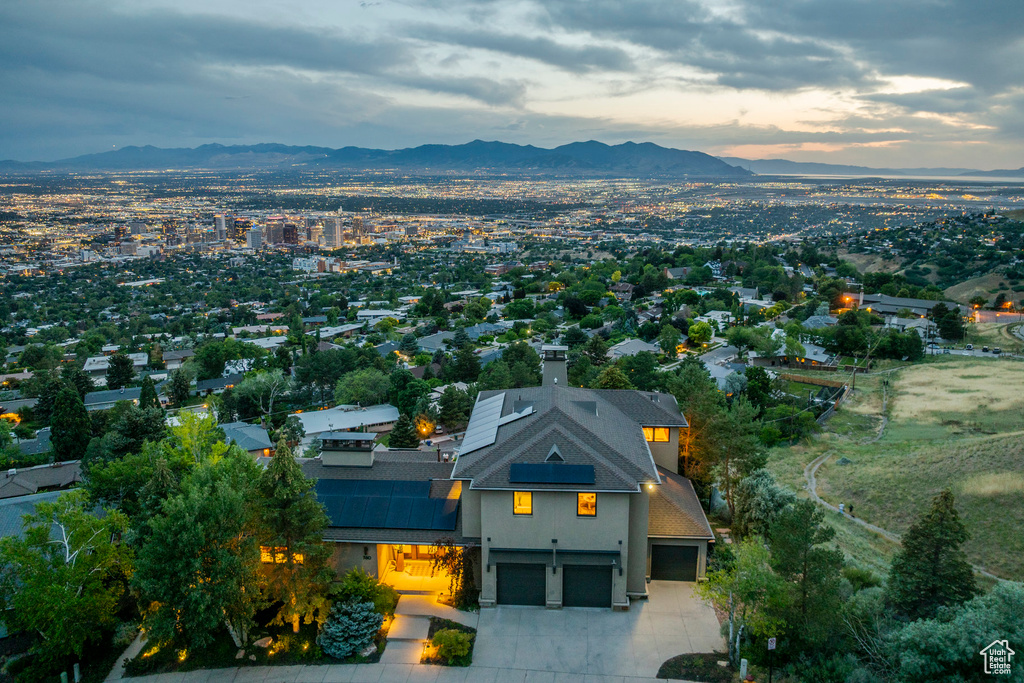 Aerial view of property and surrounding area with mountains