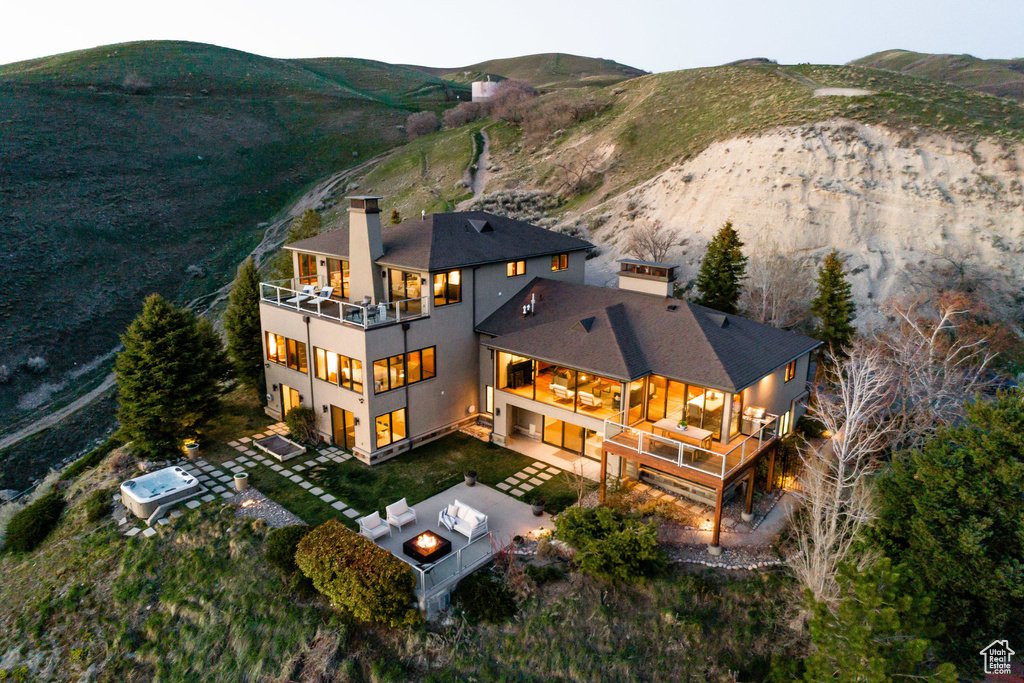 Aerial view of property and surrounding area with mountains