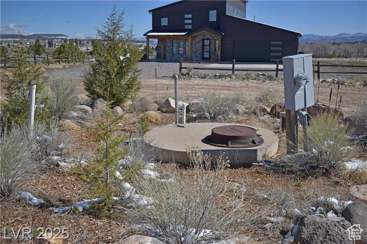 View of yard with an outdoor fire pit