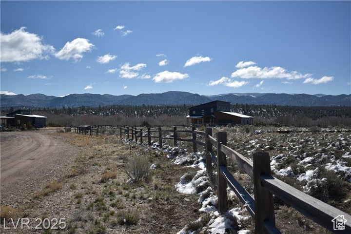 View of mountain background featuring rural landscape