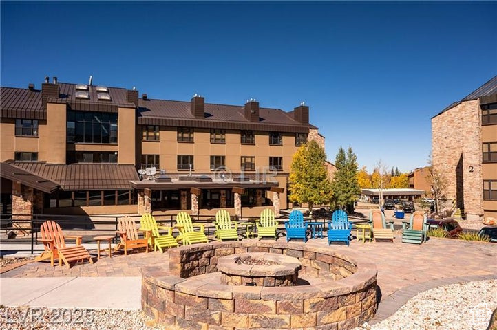 View of patio / terrace featuring an outdoor fire pit