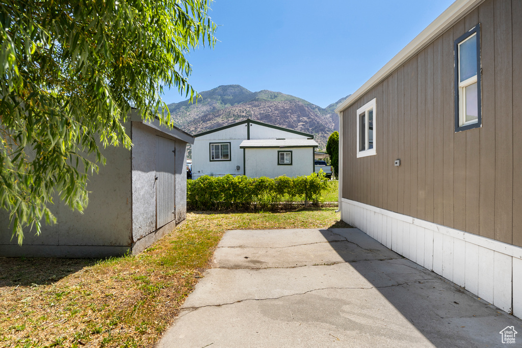 View of yard with a patio and a mountain view