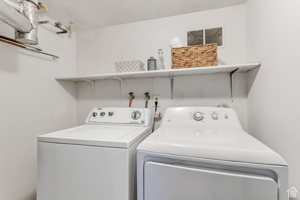 Washroom featuring washing machine and dryer