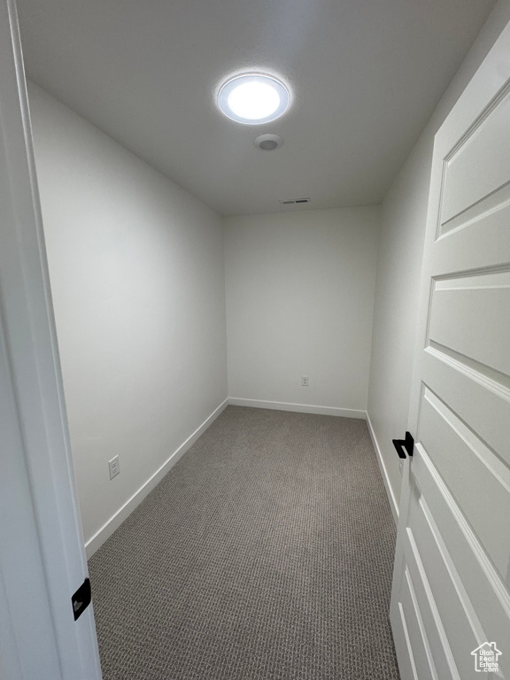 Spare room with carpet flooring and baseboards