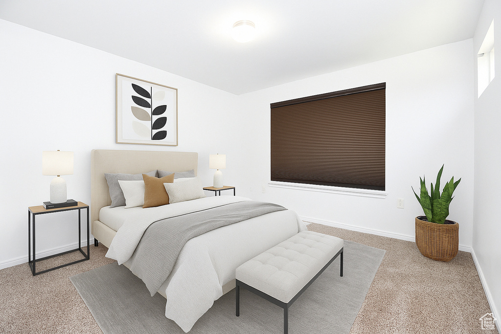 Carpeted bedroom featuring baseboards