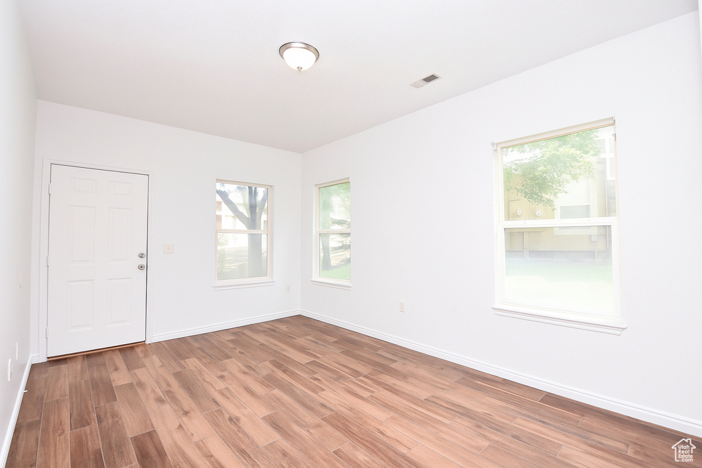 Spare room featuring light wood-type flooring