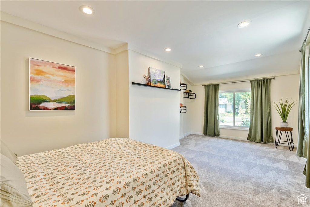 Bedroom featuring carpet flooring, recessed lighting, and lofted ceiling