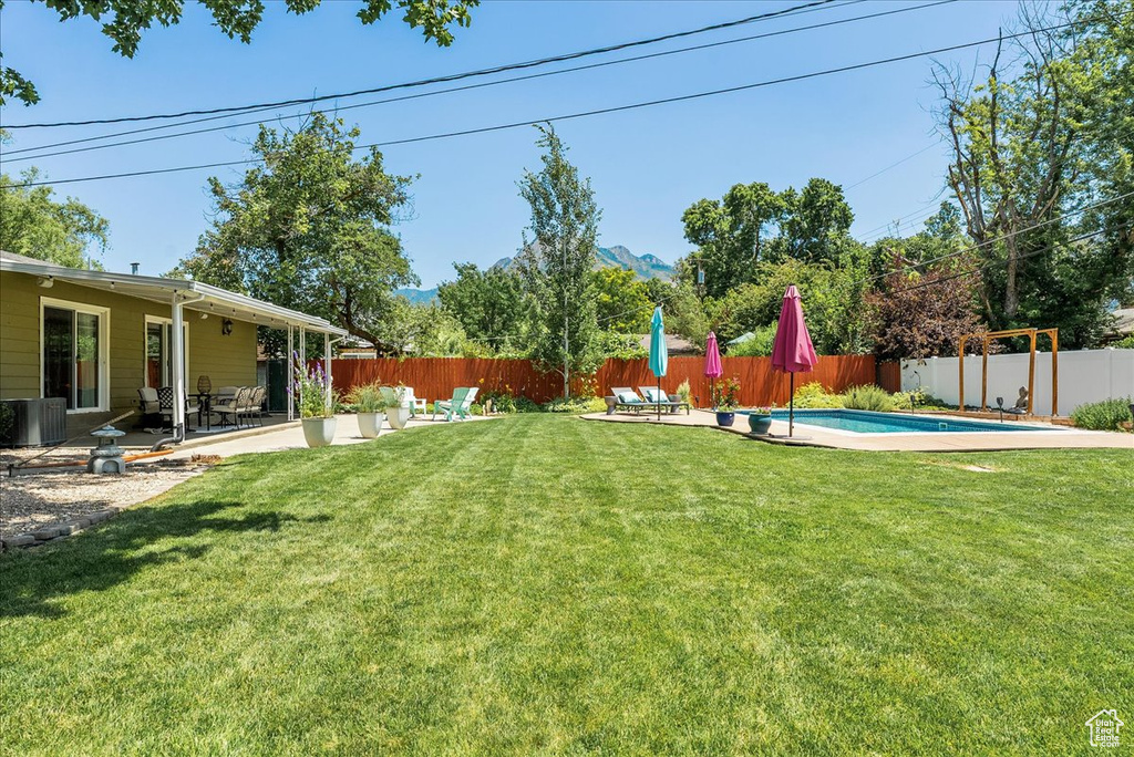 Fenced backyard featuring a patio area
