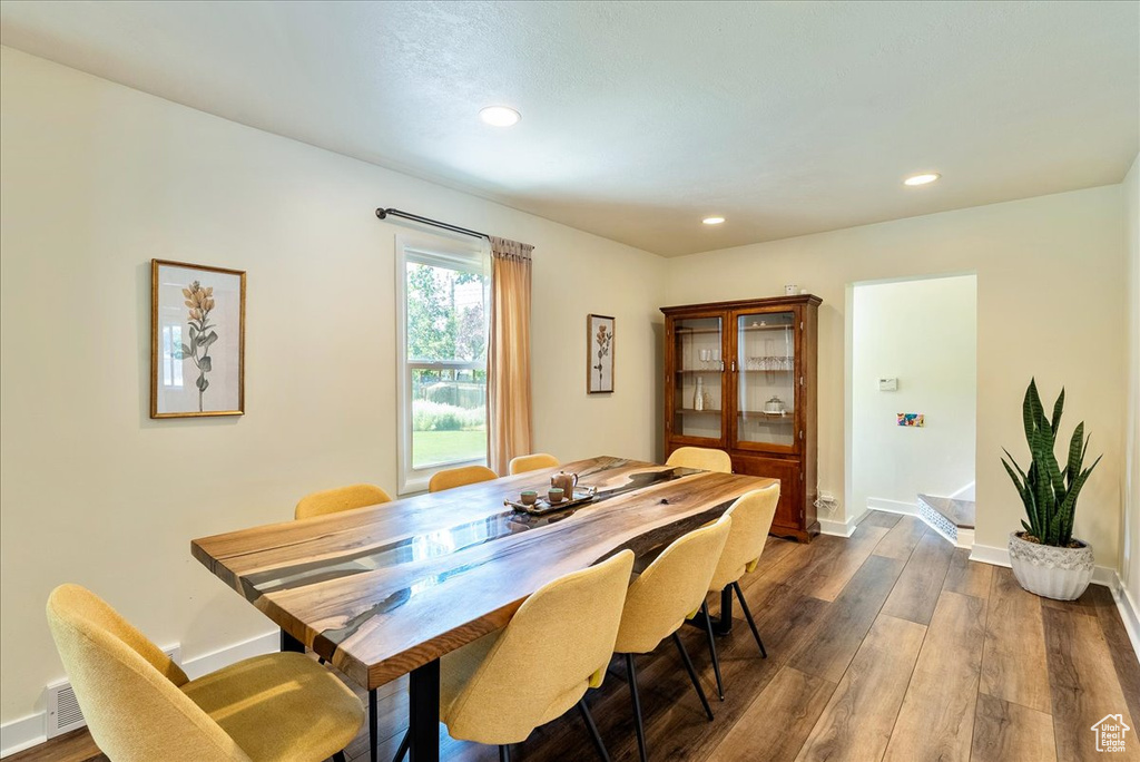Dining room featuring recessed lighting and dark wood finished floors