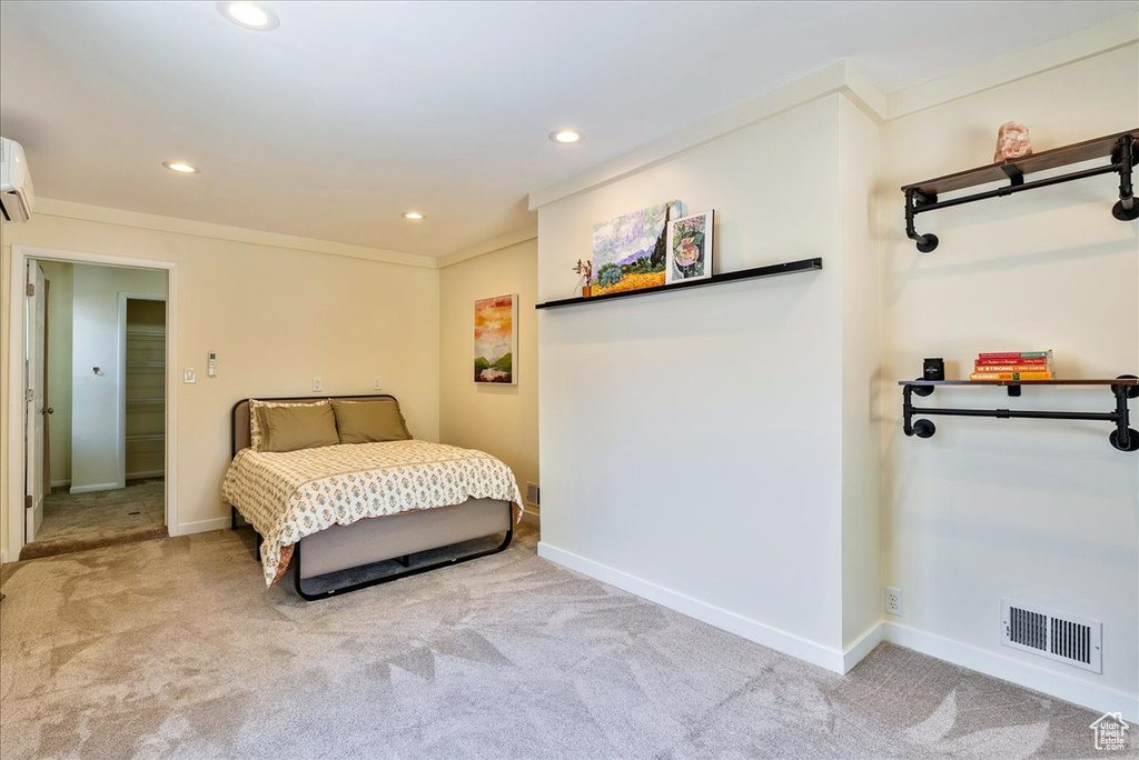 Bedroom with carpet, recessed lighting, a wall mounted AC, and crown molding