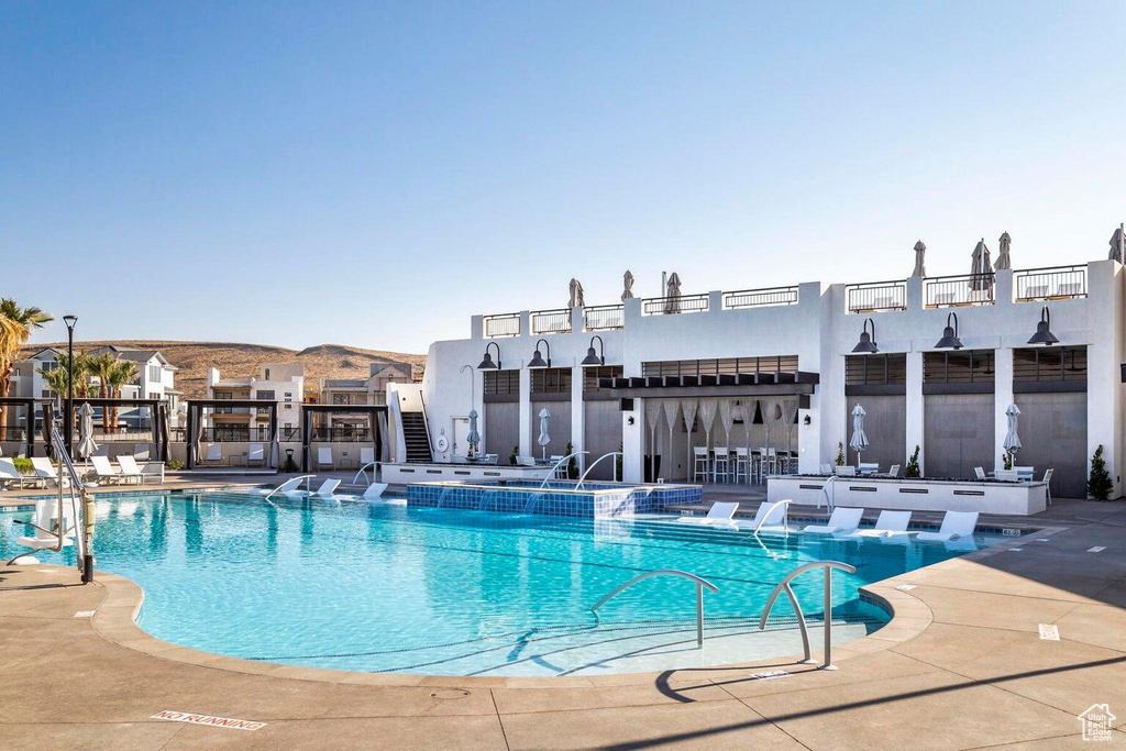 Community pool featuring a patio