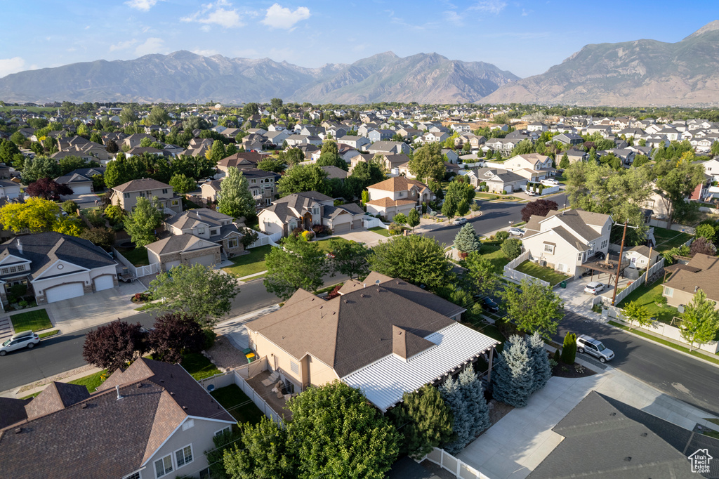 Aerial perspective of suburban area featuring a mountain backdrop