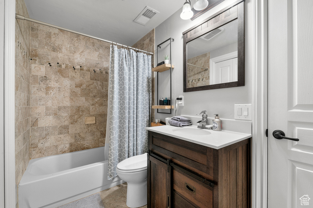 Full bath with vanity and shower / bath combination with curtain