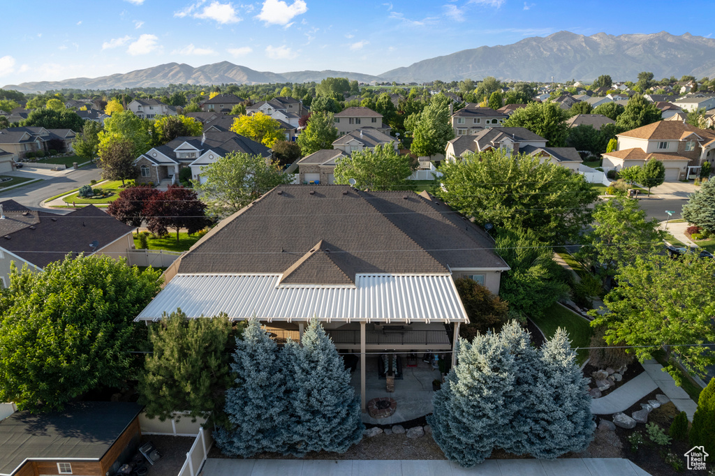 Aerial view of residential area featuring a mountain backdrop