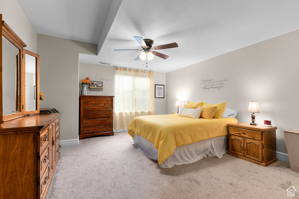 Bedroom featuring light colored carpet and ceiling fan