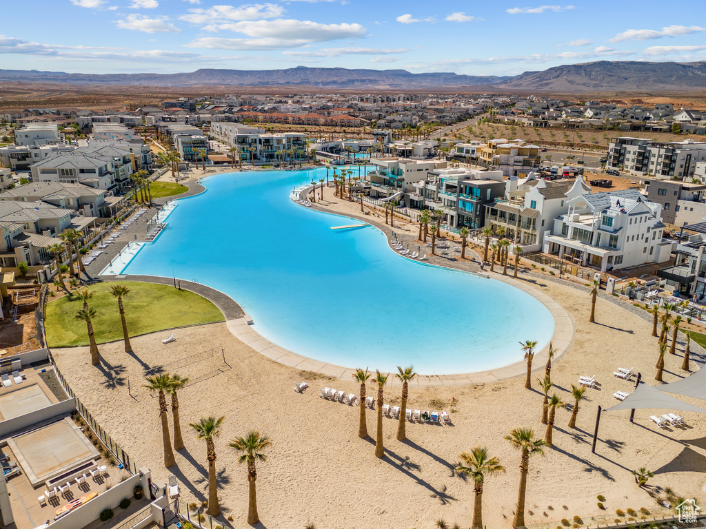 View of swimming pool with a mountain view