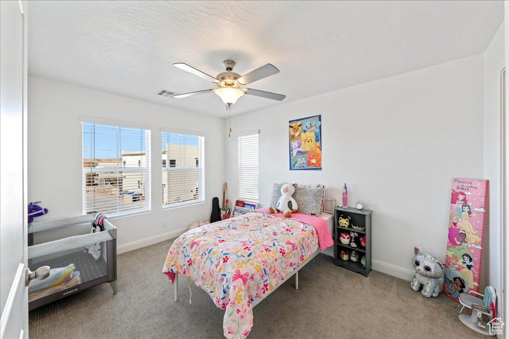 Bedroom featuring carpet flooring and ceiling fan